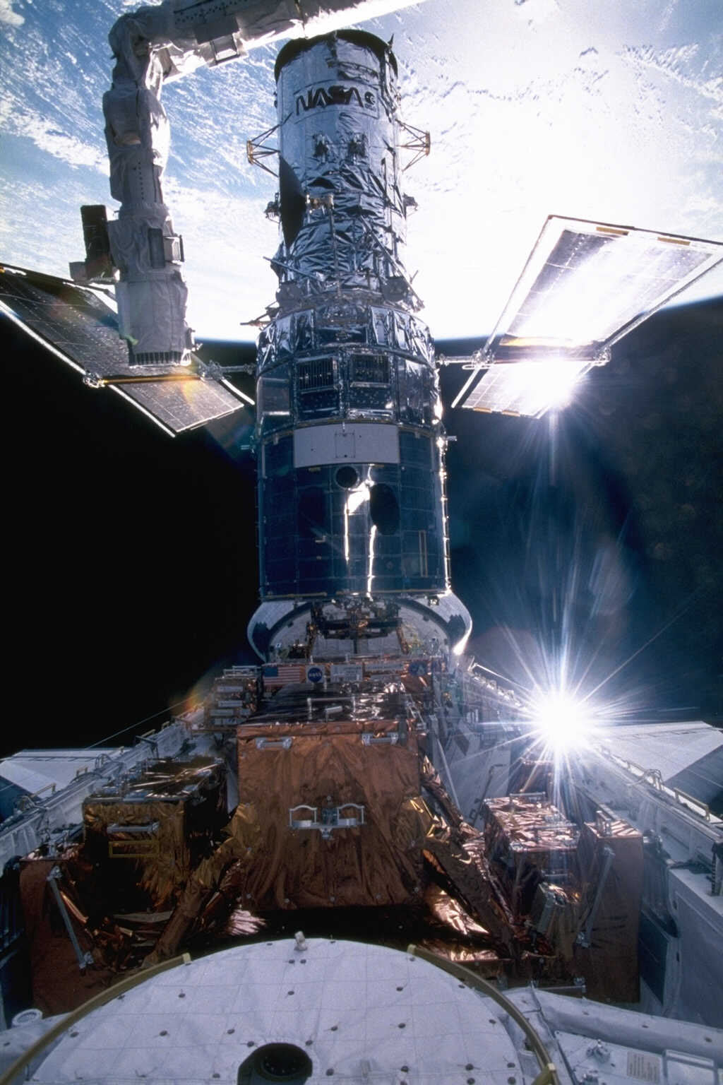 Кодовое обозначение полёта в НАСА: Hubble Space Telescope — Servicing Mission 04 (HST-SM04), или Hubble Servicing Mission (HSM)